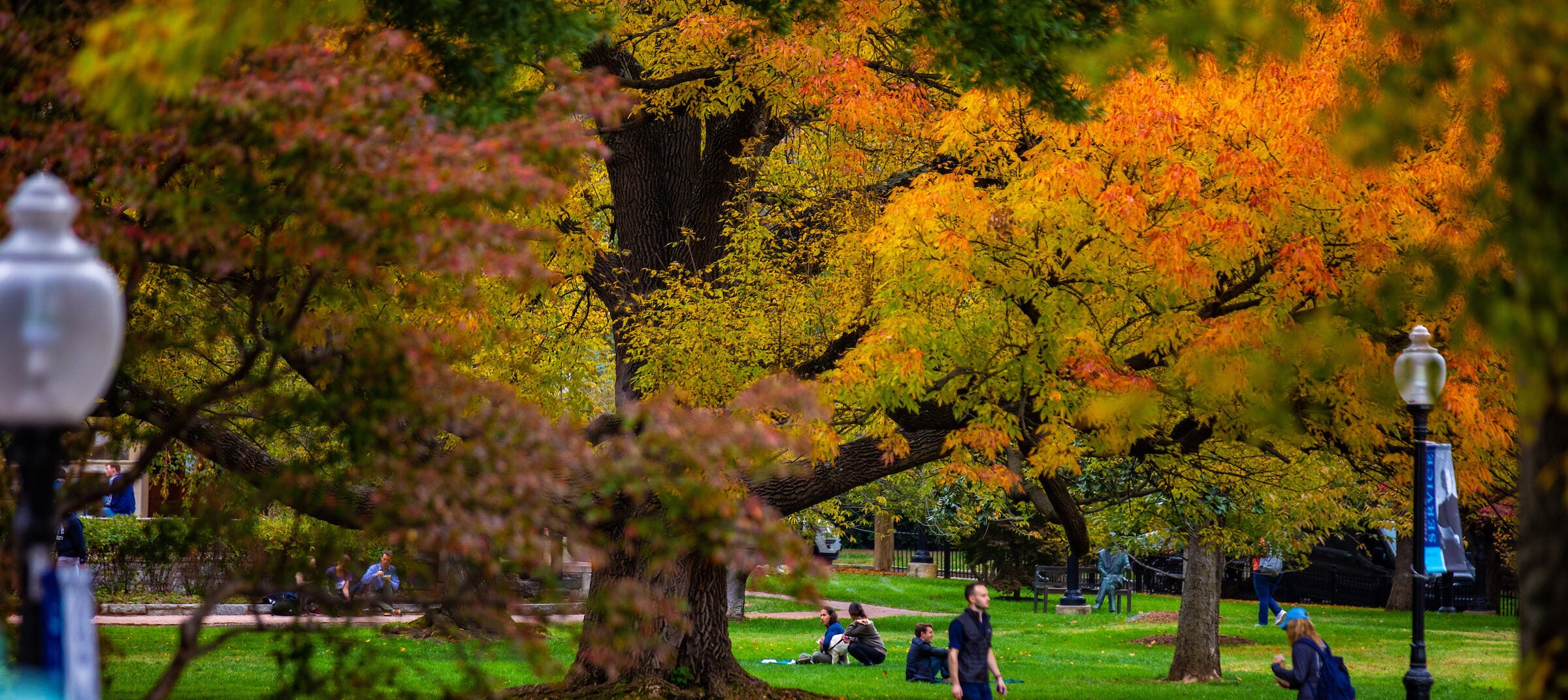 Student happily walking to class on a fall day