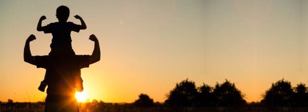 Father,And,Son,Playing,In,The,Park,At,The,Sunset