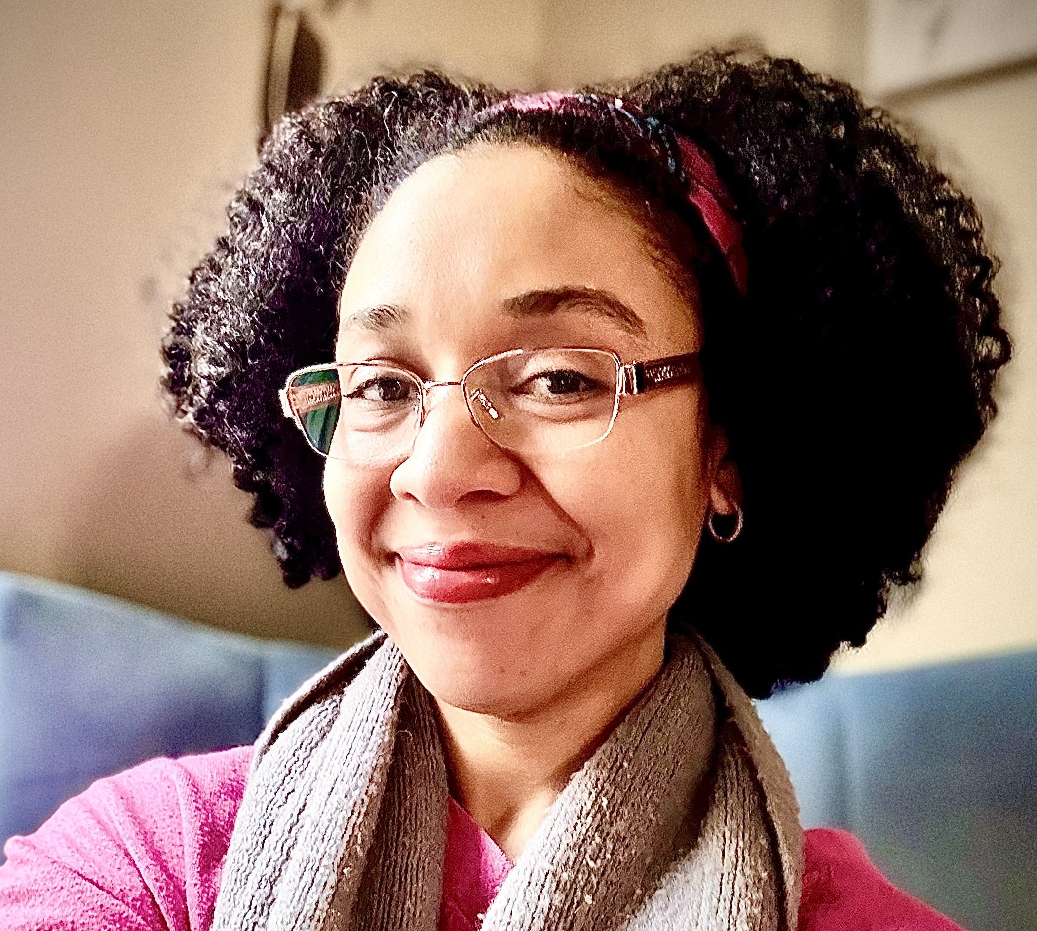 Photo of Nicole Walters in a scarf and glasses
